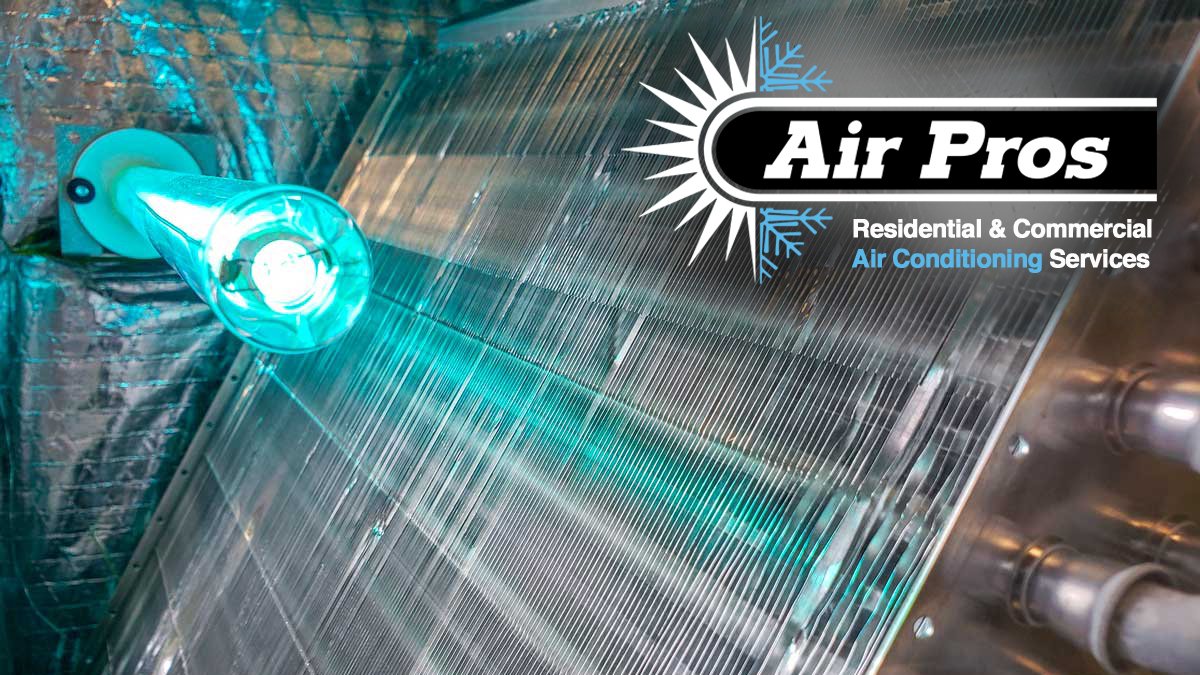 Close-up of an HVAC coil with UV Lights installed to improve air quality; Air Pros logo with “Residential & Commercial Air Conditioning Services” text overlayed.
